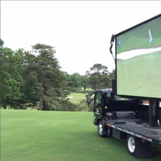 mobile led billboard showing golf outdoors